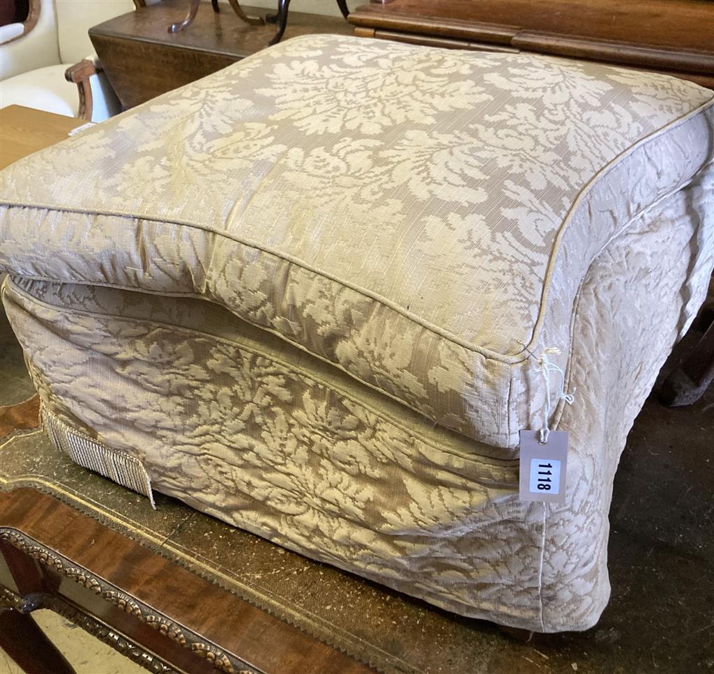 An early 20th century upholstered concave sided footstool, width 65cm, height 42cm